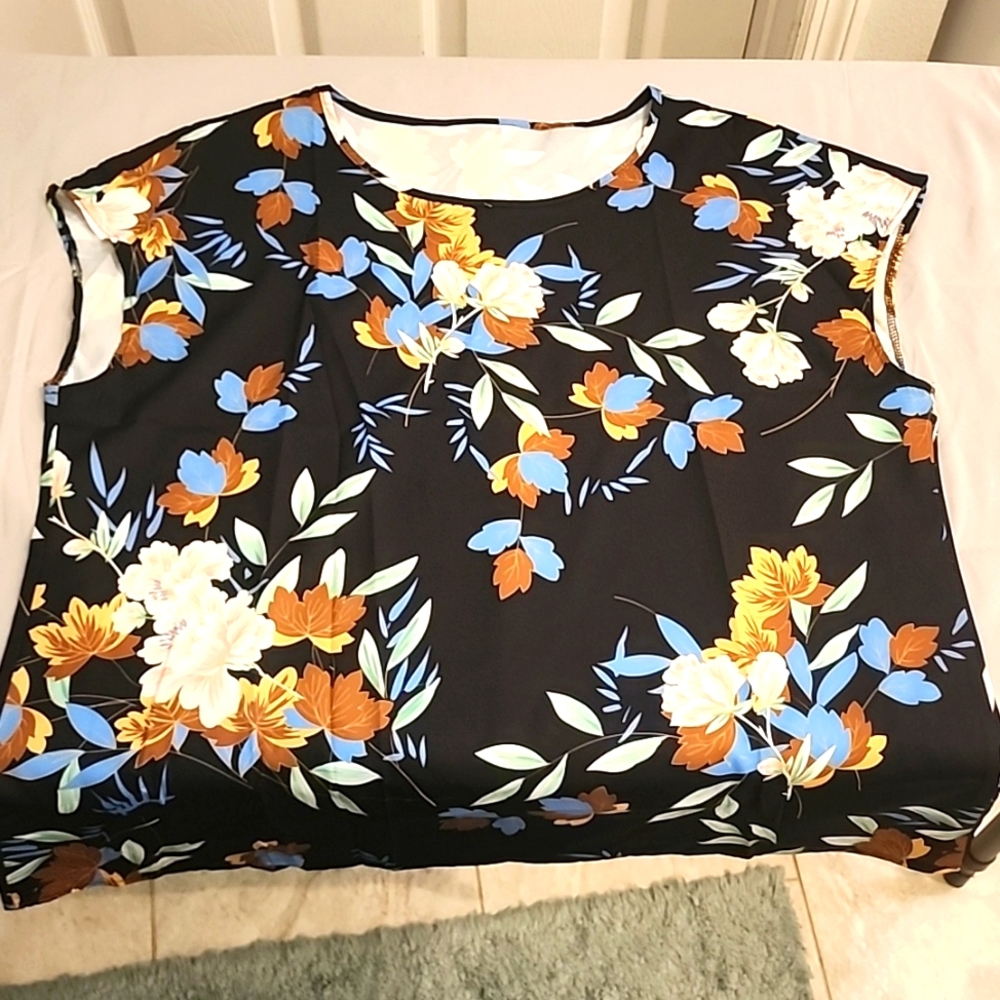 Sleeveless black floral blouse